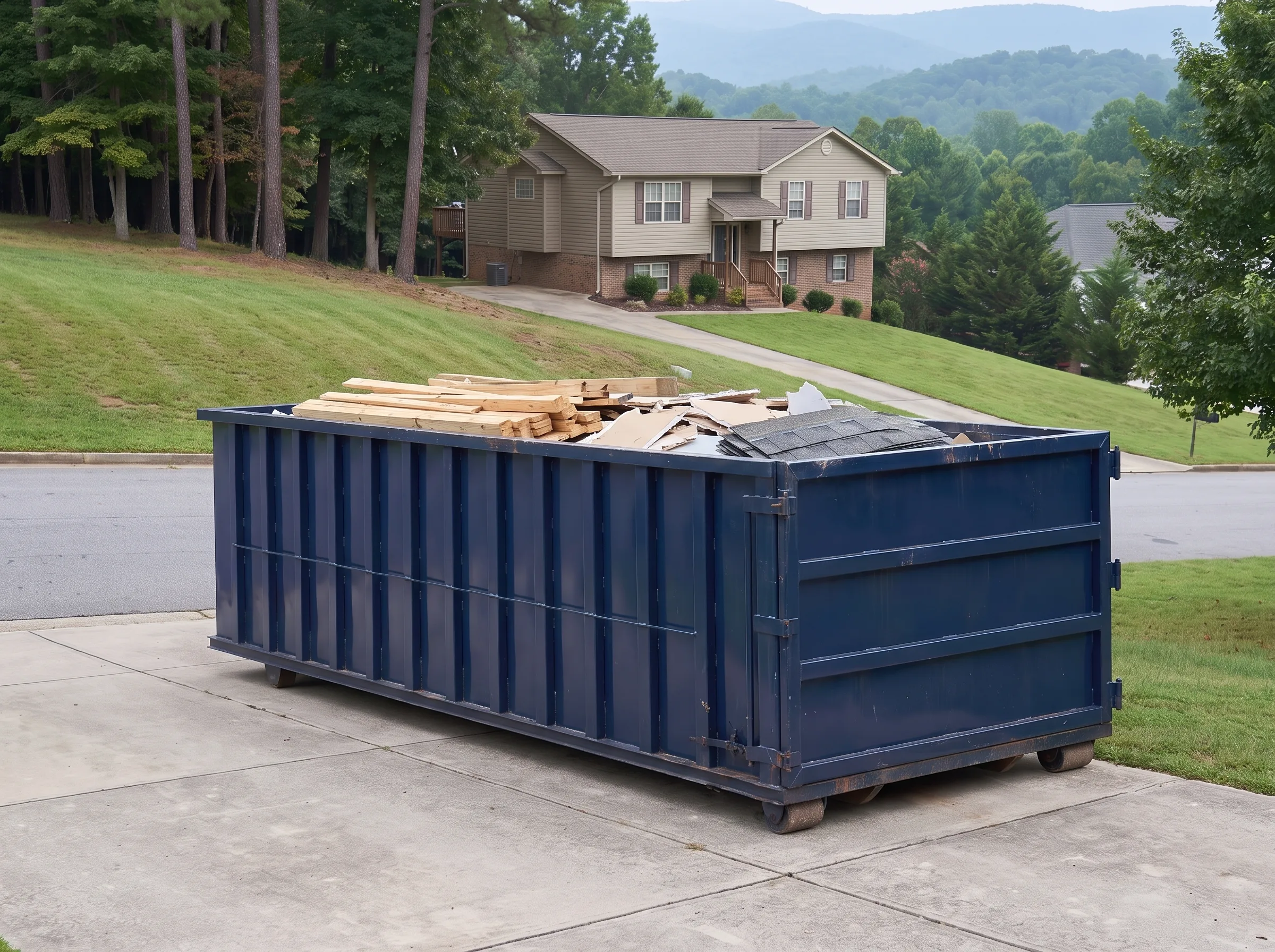 Roll-off dumpster being loaded in Davidson County, NC